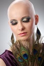 Bald woman with peacock plumes Royalty Free Stock Photo