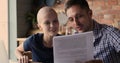 Bald woman her husband reading health test results celebrate remission