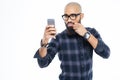 Baldheaded african american man touching moustache and taking selfie