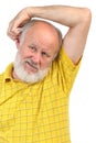 Balding senior man skratching his other ear Royalty Free Stock Photo