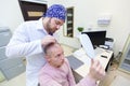 Baldness treatment. Patient suffering from hair loss in consultation with a doctor. Preparation for hair transplant Royalty Free Stock Photo