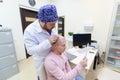 Baldness treatment. Patient suffering from hair loss in consultation with a doctor. Preparation for hair transplant Royalty Free Stock Photo