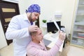 Baldness treatment. Patient suffering from hair loss in consultation with a doctor. Preparation for hair transplant Royalty Free Stock Photo
