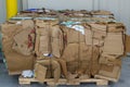 Bale of Cardboard Boxes on a Wooden Pallet for Recycling