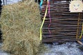 A bale of hay and a fence of dried branches