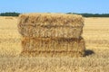 Bale of hay. Haystacks harvested on field in summer. Farming symbol of harvest time with dried grass straw Royalty Free Stock Photo