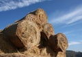 Bale of hay in stock under blue sky Royalty Free Stock Photo