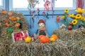 a bale of straw apples and pumpkins were lovingly arranged as decoration