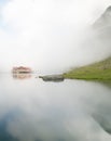 Balea chalet near balea lake on transfagarasan road romania in a foggy day Royalty Free Stock Photo