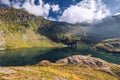 Balea glacier lake near the Transfagarasan road, panoramic view. Balea Lake, is a glacier lake situated at 2034m of altitude in Royalty Free Stock Photo