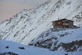 Balea Lake Chalet on sunset in the Fagaras Mountains Royalty Free Stock Photo