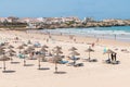 Baleal beach with umbrellas and wooden lounge chairs in  Portugal Royalty Free Stock Photo