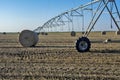 Baled straw coiled and irrigation system Royalty Free Stock Photo