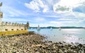 Balem Tower, historic fortification landmark near Lisbon, Portugal with sailboats in the background