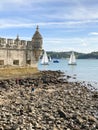 Balem Tower, historic fortification landmark near Lisbon, Portugal with sailboats in the background