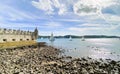 Balem Tower, historic fortification landmark near Lisbon, Portugal with sailboats in the background