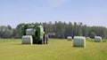 Baler Wrapper Baling Silage in Field Royalty Free Stock Photo