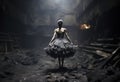 Balerina in a dirty dress standing in a coil mine.