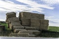 Bales of Hay on farm field after harvest Royalty Free Stock Photo