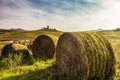 Bales of hay on a farm at sunset Royalty Free Stock Photo