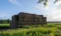 Bales of hay. Haystack. Bales on the green field with clear blue sky and sunshine. Agriculture. Royalty Free Stock Photo