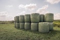 Bales of hay packed with green plastic film Royalty Free Stock Photo