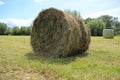 Bales of hay, packed and not packed at the countryside in the summer. Royalty Free Stock Photo