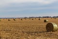 Bales of hay. Post harvest corn field. Storage facility. Irrigation system. broken corn stalks. farmland. farm in Nebraska Royalty Free Stock Photo