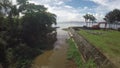 Tributary river going to the huge surrounding lake of Taal Vocano under cloudy sky