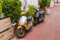 Bali, Crete, Greece - October 7, 2019: Old vintage scooters on a cozy street of the popular resort of Crete