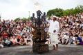 BALI - DECEMBER 30: man lights a fire before traditional Balinese Kecak dance at Uluwatu Temple on DECEMBER Royalty Free Stock Photo