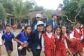 Bali, December 2019. a medical student taking picture together with elementary school stucent
