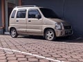 Bali, 12 December 2022 ; Suzuki's small car parked beside the house