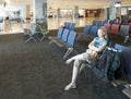 BALI, DENPASAR- MARCH 28, 2020: Woman in an empty airport hall during a coronavirus pandemic