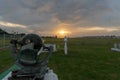 BALI/INDONESIA-APRIL 05 2019: Campbell-stoke at Ngurah Rai Meteorology Station with green grass and orange sunset under the cloudy Royalty Free Stock Photo