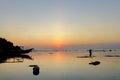 Fisherman in the Sunset at the wonderful Pantai Padang Padang beach in Bali, Indonesia