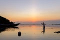 Fisherman in the Sunset at the wonderful Pantai Padang Padang beach in Bali, Indonesia