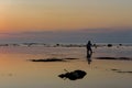 Fisherman in the Sunset at the wonderful Pantai Padang Padang beach in Bali, Indonesia
