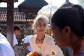BALI, INDONESIA-AUGUST 29,2012: An older woman came to a religious ceremony Galungan in the family temple