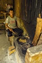 Bali, Indonesia - August 13th 2018: Man roasting luwak coffee beans in Ubud. Luwak coffee is very expensive and famous