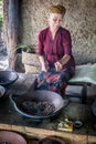 Old woman roasting luwak coffee beans in Ubud