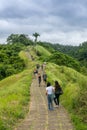 Tourists walking the famous Campuhan Ridge Walk in Ubud