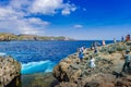 BALI,INDONESIA-AUGUST 16,2019:Tourists visit Angels billabong in Nusa Penida Island, near the big waves of Bali, Indonesia Royalty Free Stock Photo