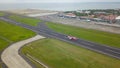 Bali, Indonesia, December 4, 2020. Aerial view of airplanes at the airport runway. Indonesian budget airline, Air Asia plane