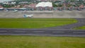 Bali, Indonesia, December 4, 2020. Aerial view of airplanes at the airport runway. Indonesian budget airline, Garuda Indonesia