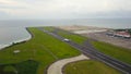 Bali, Indonesia, December 4, 2020. Aerial view passengers airplanes at the airport runway. Garuda Indonesia plane taking off from
