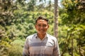 BALI, INDONESIA - DECEMBER 5, 2017: Closeup portrait of asian balinese indonesian man in the jungle of Bali island.