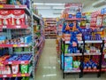 Bali, Indonesia - February 06, 2023: Aisle with various kinds of goods on the shelves inside Alfamart