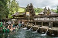 People praying in the holy spring water of Pura Tirta Empul  temple in Tampa, Bali, Indonesia Royalty Free Stock Photo