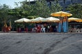 Tents on the edge of Kuta beach offer snacks, drinks and rental of surfboards as well as surf trainers.